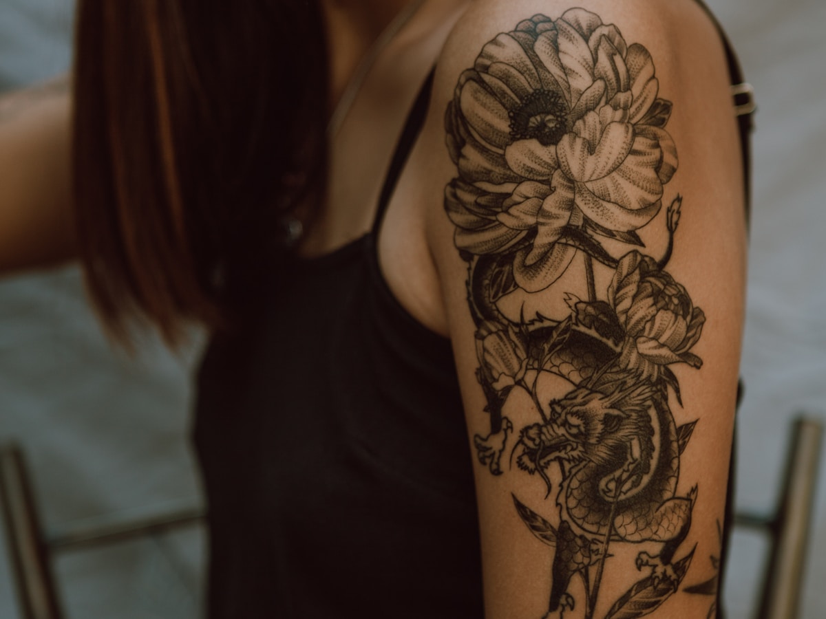 Botanical blackwork tattoo detail
